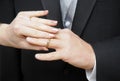 Bride slipping ring on finger