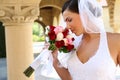 Bride smelling wedding bouquet