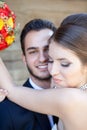 Bride smiling while embracing the groom Royalty Free Stock Photo