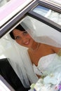 Bride smiling through window Royalty Free Stock Photo