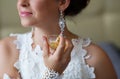Bride spraying perfume on her neck Royalty Free Stock Photo