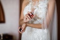 Bride spraying perfume on her wrist Royalty Free Stock Photo