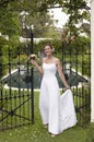 Bride Standing At The Entrance Gate Royalty Free Stock Photo