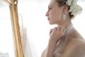 Bride standing in front of a mirror