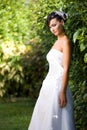 Bride standing in garden