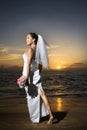 Bride standing holding bouquet