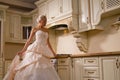 Bride stands in the kitchen