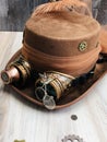 bride steampunk hat, light brown, goggles, gears, feather and ribbon