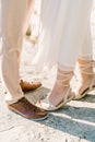 Bride stood on tiptoes next to groom. Cropped. Faceless Royalty Free Stock Photo