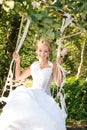 Bride on a swing. Joy, happiness, cheerful. Wedding day
