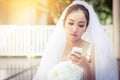 Bride talking on cell phone in wedding dress Royalty Free Stock Photo