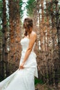 Bride with a tattoo on background of leaves and forest backlight Royalty Free Stock Photo