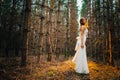 Bride with a tattoo on background of leaves and forest backlight Royalty Free Stock Photo