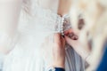 Bride tied white dress