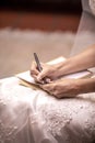 Bride to be writing her vows to her husband to be before the wedding ceremony Royalty Free Stock Photo