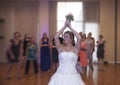 Bride tossing bouquet Royalty Free Stock Photo