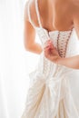 Bride unzipping her dress Royalty Free Stock Photo