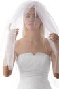 Bride with veil on the face looks in to the lens Royalty Free Stock Photo