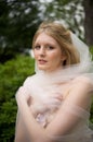 Bride with veil wrapped around her