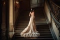 a bride walking up the stairs in her wedding dress Royalty Free Stock Photo