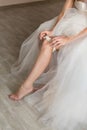 Bride wear the garter Royalty Free Stock Photo