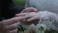 Bride wear ring on groom`s finger. The groom puts the wedding ring to finger of the bride. marriage hands with rings Royalty Free Stock Photo