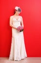 Bride wearing white dress holds bouquet Royalty Free Stock Photo