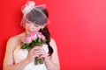 Bride wearing white dress holds bouquet Royalty Free Stock Photo