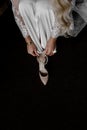 Bride wears a wedding shoe. vertical photo Royalty Free Stock Photo