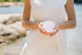 Bride with wedding crown and bouquet of seashels