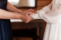 Bride on wedding day holding her mother`s hands. an old woman holds her young daughter married Royalty Free Stock Photo