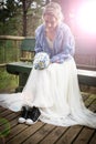 Bride at wedding day with wrong shoes Royalty Free Stock Photo
