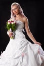 Bride in a wedding dress with a bouquet of tulips Royalty Free Stock Photo