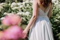 Bride in a wedding dress in flowers Royalty Free Stock Photo