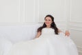 Bride in wedding dress sitting on the couch Royalty Free Stock Photo