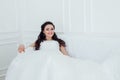 Bride in wedding dress sitting on the couch Royalty Free Stock Photo