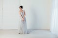 Bride in wedding dress in white room Royalty Free Stock Photo