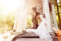 Bride Wedding Outdoor Portrait, Beautiful Woman in Elegant Dress in Old Summer Gazebo Royalty Free Stock Photo