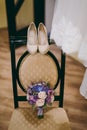 Bride wedding shoes with high heels and silver brilliant earrings on sheep`s clothing Royalty Free Stock Photo