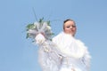 Bride in white dress again blue sky Royalty Free Stock Photo