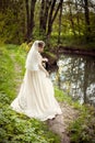 Bride in a white dress on the background of nature. Wedding photography