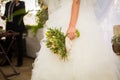 Bride in white dress hold wedding boquet in her hand Royalty Free Stock Photo