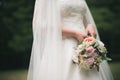 bride in white dress holding bouquet Royalty Free Stock Photo