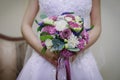 bride in a white dress holding a bouquet