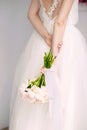 Bride in white dress holding wedding bouquet with tender flowers, summer wedding concept Royalty Free Stock Photo