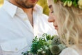 Bride in white dress and wreath and groom portrait in sunny summer day. Rustic outdoor wedding concept Royalty Free Stock Photo