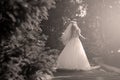 Bride doing pirouette in the park