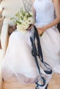 Bride in white wedding dress holding a bouquet of flowers Royalty Free Stock Photo