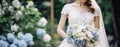 Bride in white wedding dress holding bridal bouquet Royalty Free Stock Photo