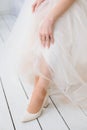 Bride in white wedding dresses dress shoes, Hands and feet of the bride Royalty Free Stock Photo